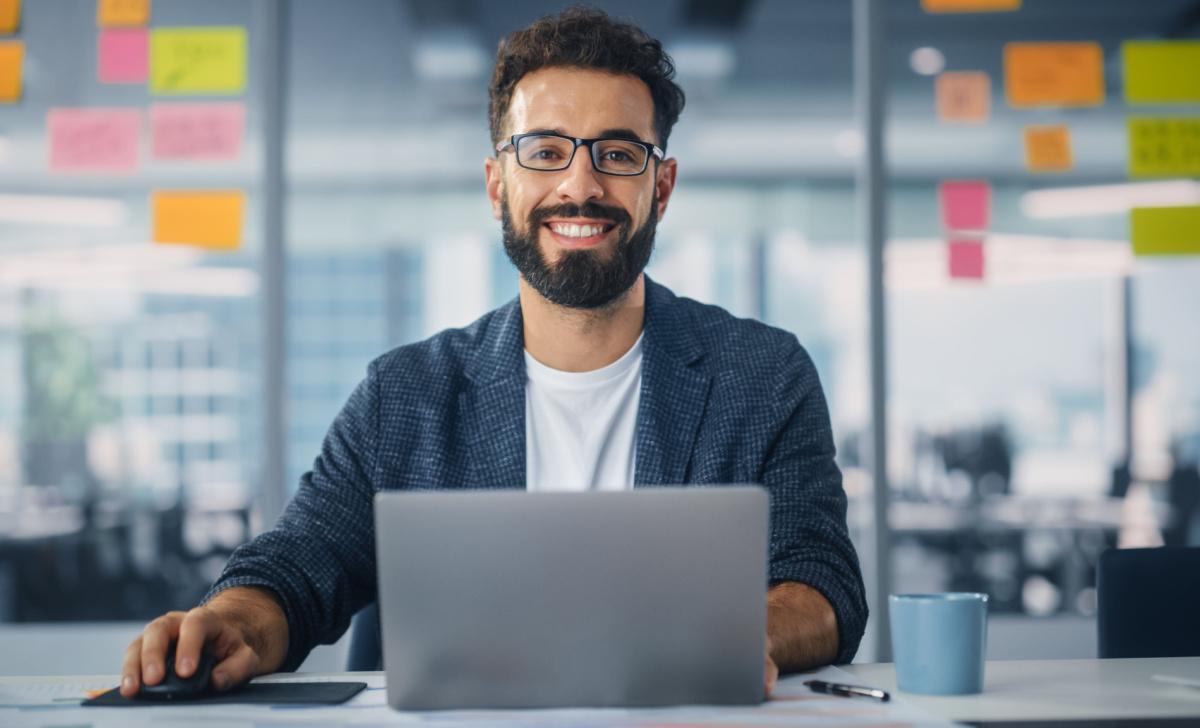 Man sitting in a conference room with his laptop