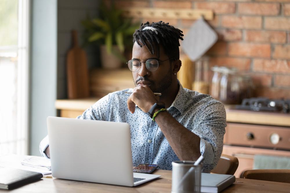 An employee working from home getting support for their computer. 